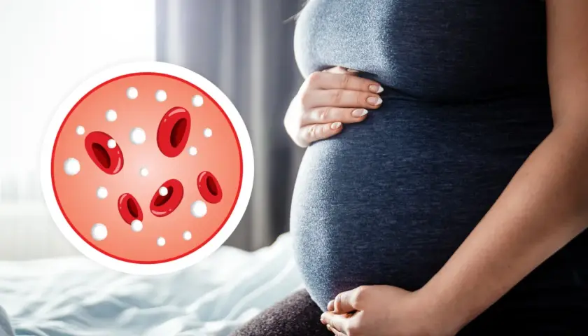 Ciężarna kobieta trzymająca się za brzuch, obok okrągły wykres z czerwonymi krwinkami i białymi kropkami.